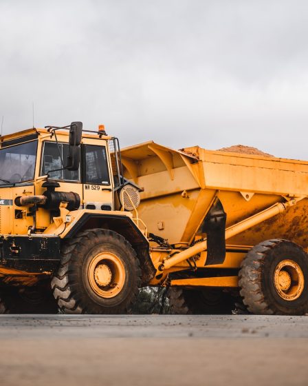 yellow and black heavy equipment on snow field