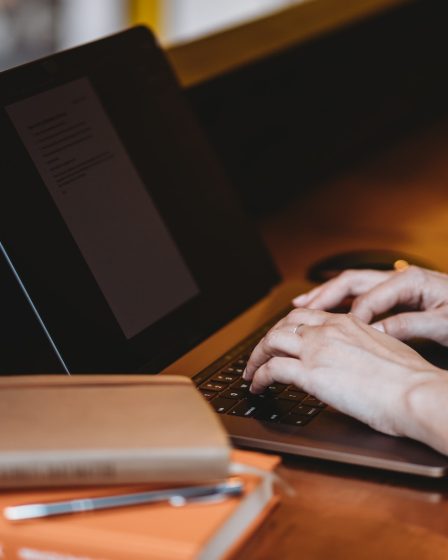 person using black laptop computer